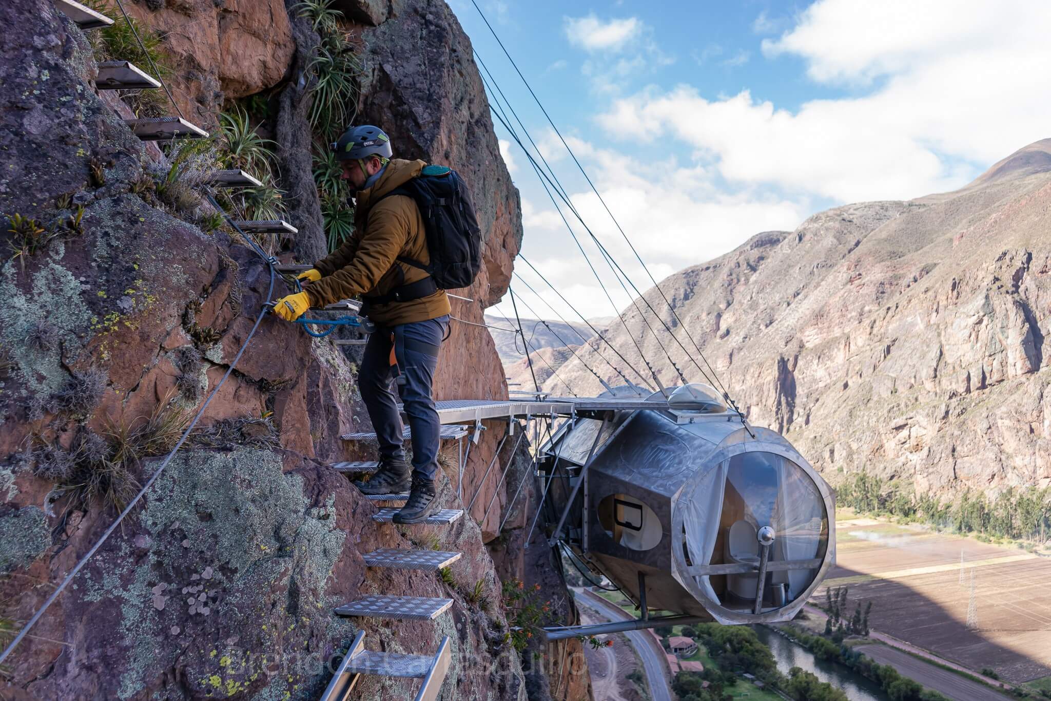 Skylodge Adventure Suites hanging from a cliff in the Sacred Valley, Peru